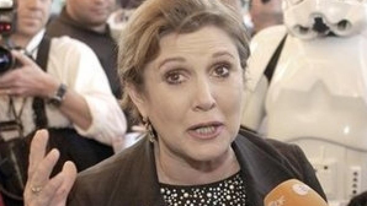 Carrie Fisher, despre John Travolta: Ştim că e homosexual, dar nu ne pasă