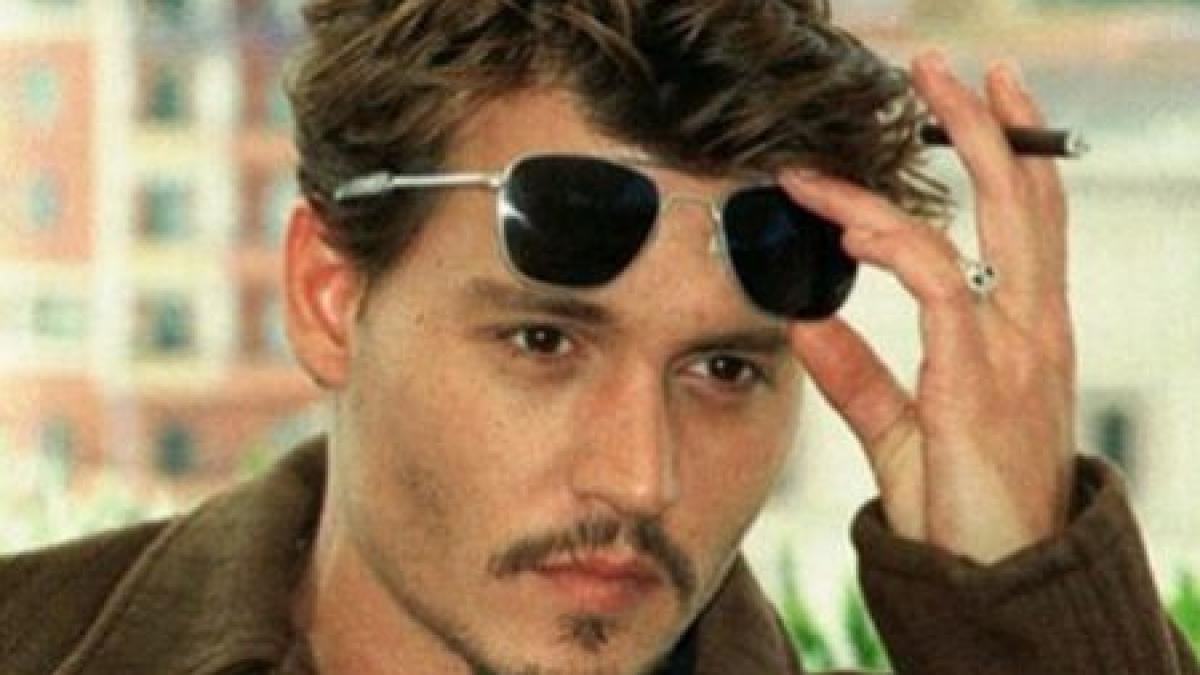 Johnny Depp a fost muşcat de câinele cuplului Angelina Jolie-Brad Pitt