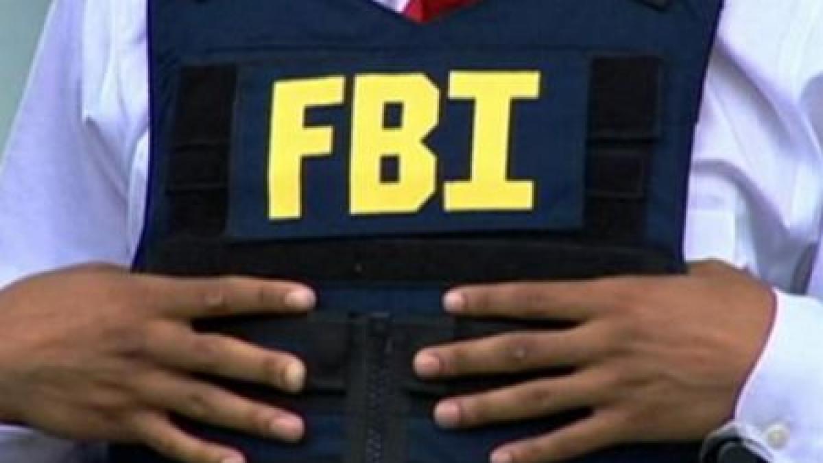 Dosarul a 14 români acuzaţi de fraudă şi furt de identitate, prezentat de FBI