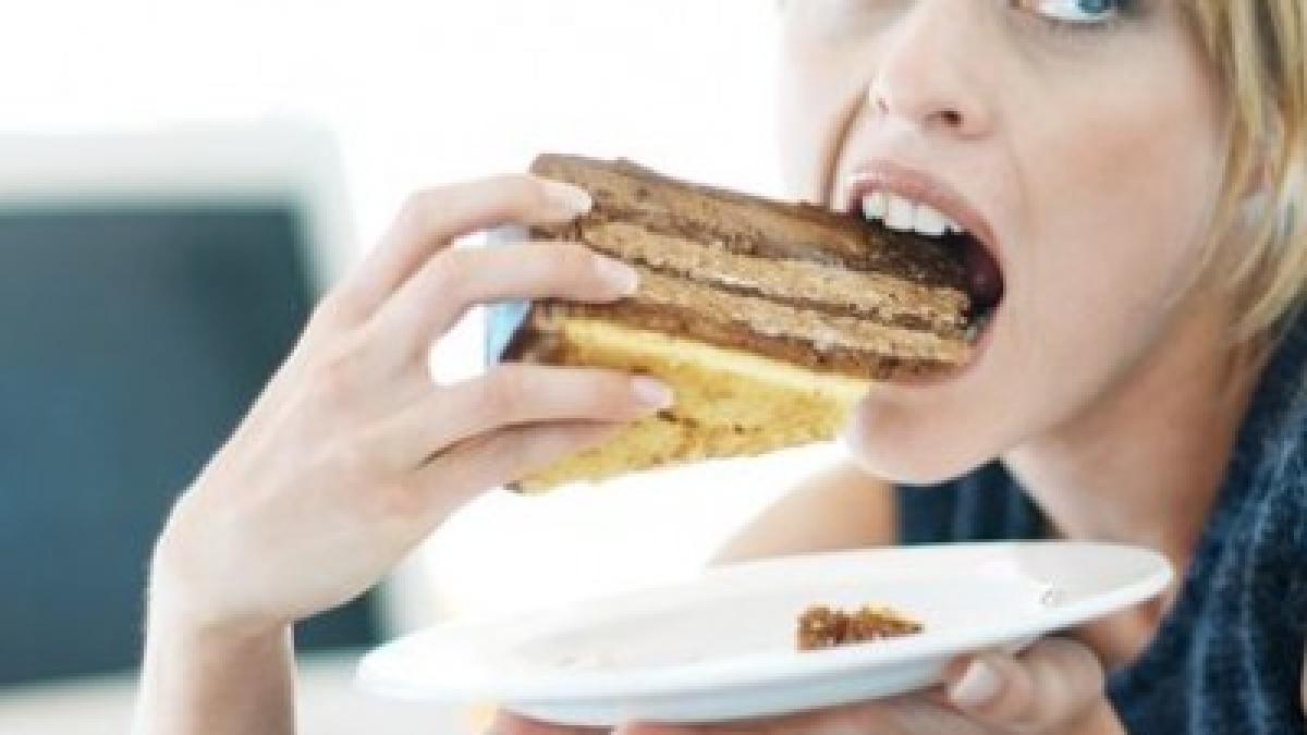 Close-up-of-a-woman-eating-a-large-piece-of-cake-871005-400x400.jpeg