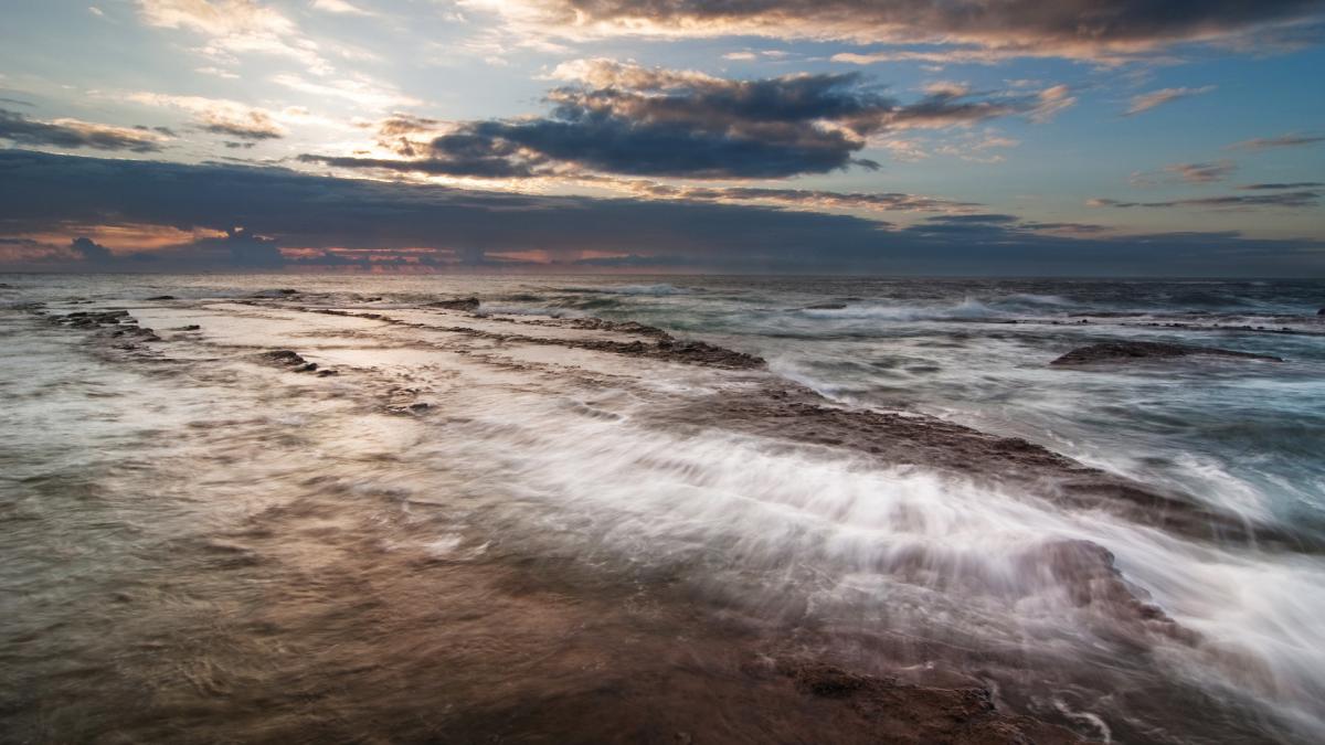 landscape-image-Sea-Water-in-Rapid-Flow-the-Dark-Sky-is-a-Heavy-Rain-Falling-.jpg