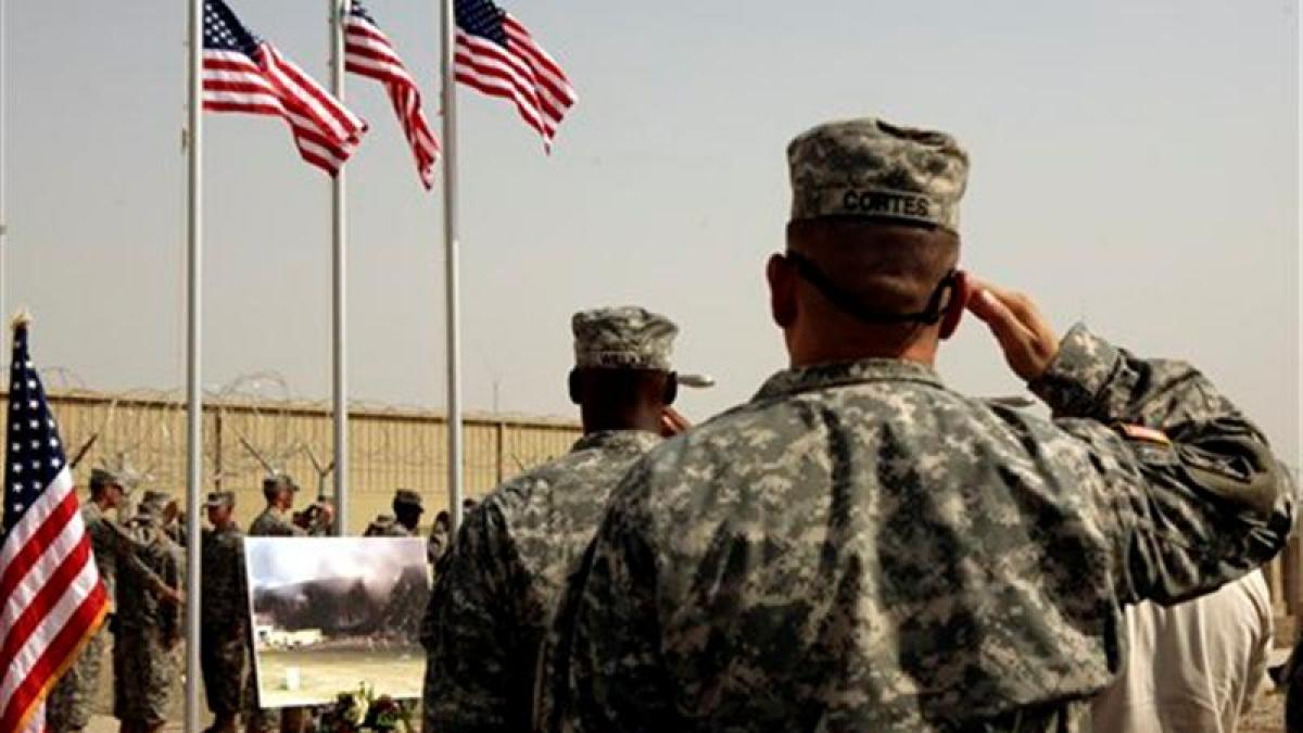 us_army_soldiers_salute_american_flags_at_a_ceremo_8846065674.jpg