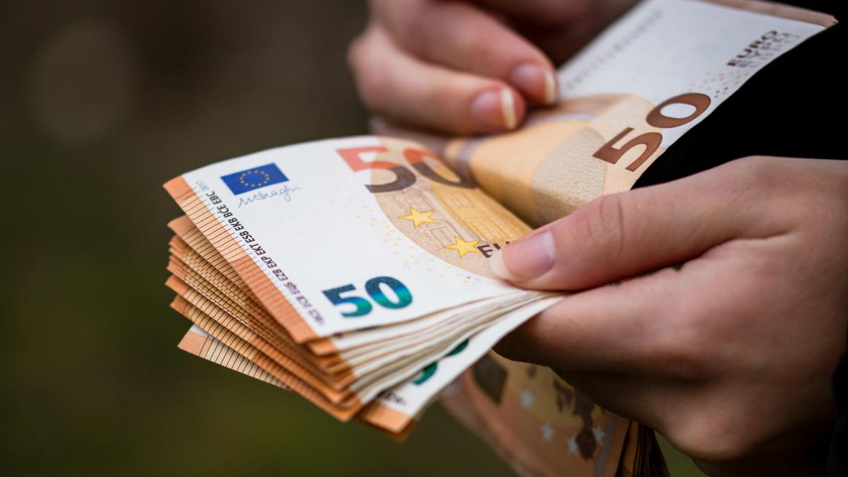 closeup-female-hands-counting-euro-banknotes-world-money-inflation-economy-concept