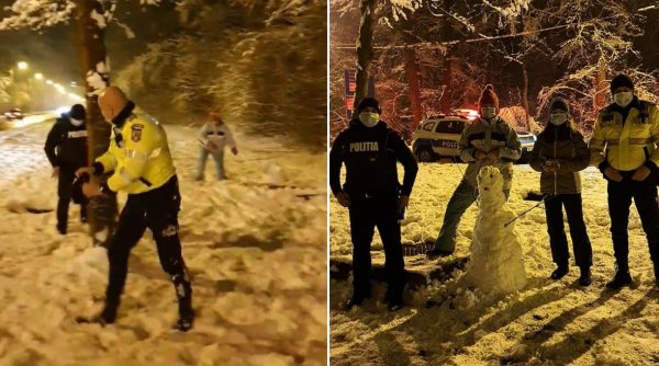 Doi poliţişti din Sibiu s-au jucat în zăpadă şi au ajutat o fetiţă să îşi facă tema pentru şcoală