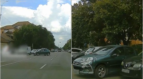 Momentul în care o maşină traversează singură un bulevard din patru benzi şi parchează, după ce şoferul a uitat să tragă frâna de mână, în Oradea